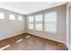 Bright home office with hardwood floors and multiple windows at 7025 Stella Pl, Stanley, NC 28164