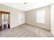 Bedroom with neutral walls and carpet, featuring a window and double doors at 7025 Stella Pl, Stanley, NC 28164
