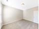 Simple bedroom with neutral walls, carpet and a window with blinds at 7025 Stella Pl, Stanley, NC 28164