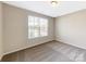 Spacious bedroom with window and neutral walls at 7025 Stella Pl, Stanley, NC 28164