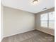 Simple bedroom with neutral walls, carpet, and a window with blinds at 7025 Stella Pl, Stanley, NC 28164