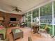 Relaxing screened porch with wicker furniture and a view of the backyard at 10227 Mount Holly Rd, Charlotte, NC 28214