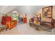 Spacious bonus room with a leather couch and home office space at 10227 Mount Holly Rd, Charlotte, NC 28214
