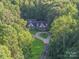 Brick house with circular driveway and private wooded lot at 10227 Mount Holly Rd, Charlotte, NC 28214