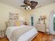 Bright bedroom with a queen-size bed and wood floors at 10227 Mount Holly Rd, Charlotte, NC 28214