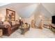 Spacious bonus room with leather sofa and large artwork at 10227 Mount Holly Rd, Charlotte, NC 28214