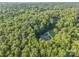 House nestled in a wooded area with a long driveway at 10227 Mount Holly Rd, Charlotte, NC 28214