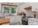 Modern kitchen featuring white cabinets and a wood countertop at 10227 Mount Holly Rd, Charlotte, NC 28214