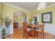Formal dining room with hardwood floors and a charming table setting at 10227 Mount Holly Rd, Charlotte, NC 28214