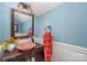 Charming bathroom with a pedestal sink, red towel, and blue walls at 10227 Mount Holly Rd, Charlotte, NC 28214