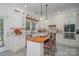 Modern kitchen with white cabinets, wood countertops and center island at 10227 Mount Holly Rd, Charlotte, NC 28214