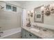 Elegant bathroom with granite countertop and decorative mirror at 10227 Mount Holly Rd, Charlotte, NC 28214