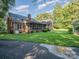 Brick house with screened porch and large backyard at 10227 Mount Holly Rd, Charlotte, NC 28214