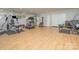 Home gym with a variety of equipment and wood floors at 10227 Mount Holly Rd, Charlotte, NC 28214