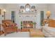 Living room with a fireplace, hardwood floors, and comfortable seating at 10227 Mount Holly Rd, Charlotte, NC 28214