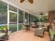 Spacious screened porch with seating and ceiling fan at 10227 Mount Holly Rd, Charlotte, NC 28214