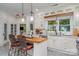 Bright kitchen featuring white cabinets, wood countertops, and an island at 10227 Mount Holly Rd, Charlotte, NC 28214