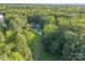 Home on a wooded lot with a long, curving driveway at 10227 Mount Holly Rd, Charlotte, NC 28214