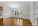 Bright dining room with hardwood floors and a charming chandelier at 721 Orphanage Rd, Concord, NC 28027