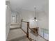 Upstairs hallway with carpeting and access to bedrooms at 721 Orphanage Rd, Concord, NC 28027