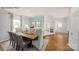 Elegant dining room with a farmhouse table and access to the foyer at 198 Giant Oak Ave, Statesville, NC 28677