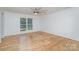 Bright bedroom with hardwood floors and a view of the backyard at 4004 Bon Rea Dr, Charlotte, NC 28226