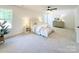 Spacious bedroom with carpeted floor, ceiling fan, and ample natural light at 118 Quiet Trl, Mooresville, NC 28117