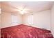 Bedroom with carpeted floor and ceiling fan at 370 21St Nw Ave, Hickory, NC 28601