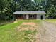 Brick ranch home with a gray roof and detached garage at 2753 Harmony Hwy, Harmony, NC 28634