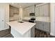 Modern kitchen with gray cabinets, quartz countertops, and an island at 490 Olympia Way, York, SC 29745