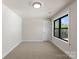 Spacious bedroom with neutral carpeting and large window at 171 Heartland Dr # 7, Rock Hill, SC 29732