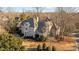 Elegant two-story home with a grand entrance and manicured lawn at 3727 Mooreland Farms Rd, Charlotte, NC 28226