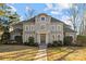 Two-story house with large windows and a landscaped yard at 3727 Mooreland Farms Rd, Charlotte, NC 28226