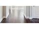 Dark hardwood floors in a bright hallway with white trim at 1346 Millview Ln, Matthews, NC 28104