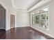 Bright living room featuring hardwood floors and large windows at 1346 Millview Ln, Matthews, NC 28104