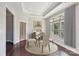 Elegant dining room with hardwood floors and a glass table set at 1346 Millview Ln, Matthews, NC 28104