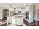 Modern kitchen with island, granite countertops, and stainless steel appliances at 1346 Millview Ln, Matthews, NC 28104
