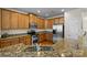 Modern kitchen with granite counters and stainless steel appliances at 9341 Lenox Pointe Dr, Charlotte, NC 28273