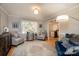 Cozy sitting room with two armchairs and a view of the kitchen at 321 10Th Ne Ave, Conover, NC 28613