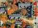 Aerial view of townhouses with fall foliage and a pool at 529 Graham St # 1F, Charlotte, NC 28202