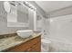 Bathroom with granite countertop, white sink and bathtub at 529 Graham St # 1F, Charlotte, NC 28202