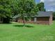 Brick home with large backyard and green lawn at 452 Mocksville Hwy, Statesville, NC 28625