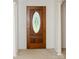 Elegant wood front door with oval glass window at 452 Mocksville Hwy, Statesville, NC 28625