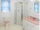 Bathroom with pink vanity, shower stall, and toilet at 452 Mocksville Hwy, Statesville, NC 28625