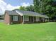 Brick ranch house with carport, and spacious lawn at 452 Mocksville Hwy, Statesville, NC 28625