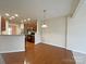 Bright dining area with hardwood floors and kitchen views at 135 S Arcadian Way, Mooresville, NC 28117