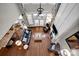 High-ceilinged living area with hardwood floors and comfortable seating at 19577 Meta Rd, Cornelius, NC 28031