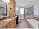 Bathroom boasts granite countertops, double sinks, and an updated shower at 19577 Meta Rd, Cornelius, NC 28031