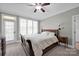 Spacious bedroom with a sleigh bed and plenty of natural light at 19577 Meta Rd, Cornelius, NC 28031