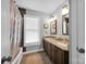 Well-appointed bathroom with double sinks and granite countertops at 19577 Meta Rd, Cornelius, NC 28031